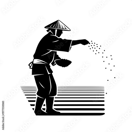 Farmer scattering rice seeds in traditional conical hat during planting season