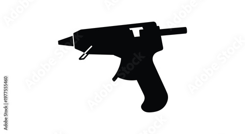 Black hot glue gun depicted in a stark dramatic silhouette