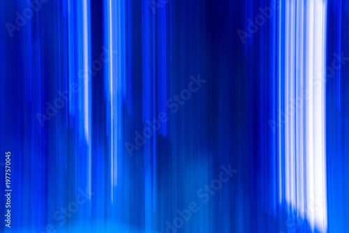Abstract Blue Motion Blur Texture: A stunning abstract background featuring vertical motion blur in shades of deep cobalt and electric blue. Perfect for modern tech projects, creative overlays.