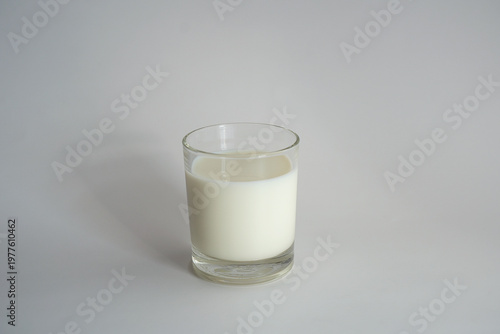 Glass of fresh milk on a white background