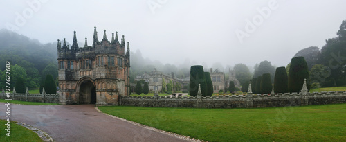 Konstfotografi Panorama of entrance gate at Lanhydrock House, moody typical english weather wit