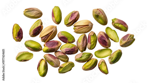 Scattered shelled and unshelled pistachios with vibrant green kernels, isolated on transparent background