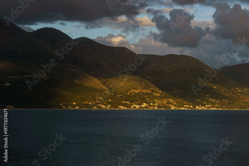 Coastline of the Adriatic Sea with mountainscape during golden hour before sunset, Qazim Pali, Albania