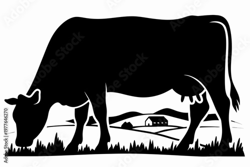 A black silhouette of a cow grazing in a rural landscape