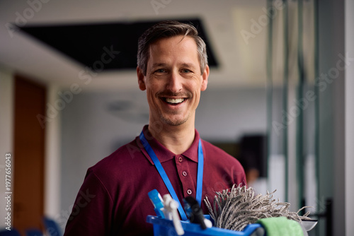 Quadro su tela Portrait of professional male cleaner at work looking at camera.