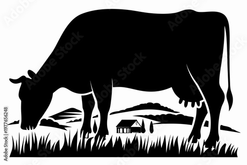 A black silhouette of a cow grazing in a rural landscape