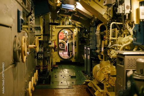 Submarine, interior and machinery with pipes, controls and equipment for navigation, exploration and underwater operations. Industrial, technology and engineering environment with metal surfaces.