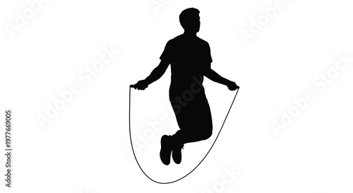A person mid jump energetically skipping rope in a striking silhouette