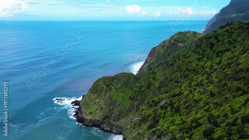 Aerial view of a charming village nestled on Madeira's verdant cliffs, overlooking the Atlantic. A breathtaking display of nature's beauty and human harmony. Arco de Sao Jorge