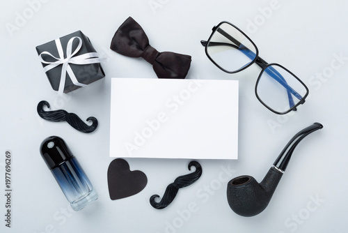 Happy Father's Day accessories on color background, top view