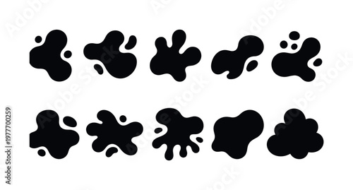 Abstract black ink splatters and blobs on a white background