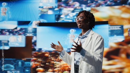 Quadro su tela Cheerful scientist speaking in mic, excited to present future of medical field