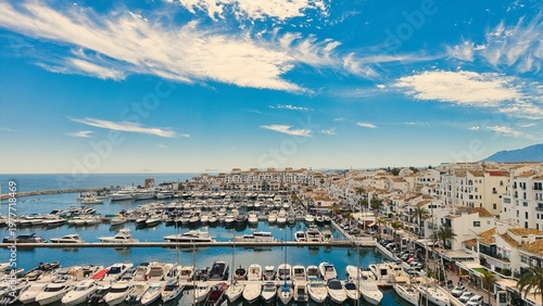 Puerto Banús marina aerial view, Marbella coastal harbor and beach, Costa del Sol, Spain drone panorama