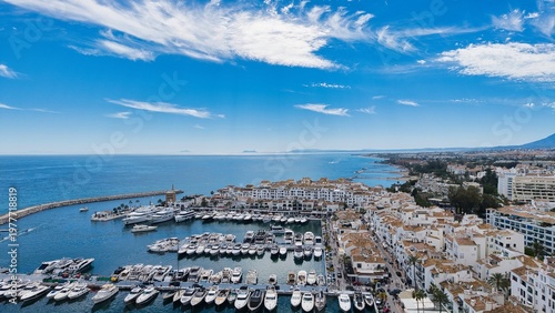 Puerto Banús marina aerial view, Marbella coastal harbor and beach, Costa del Sol, Spain drone panorama