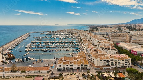 Puerto Banús marina aerial view, Marbella coastal harbor and beach, Costa del Sol, Spain drone panorama