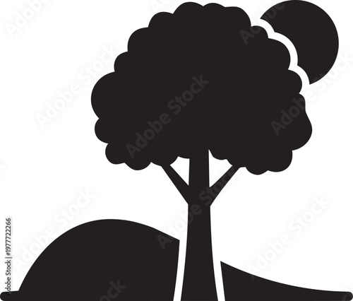 Silhouette of a tree on a hill with a sun or moon in the background