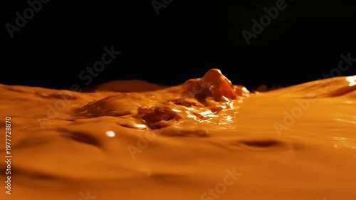 Wallpaper Mural Vibrant orange liquid splashing on a solid black background Torontodigital.ca