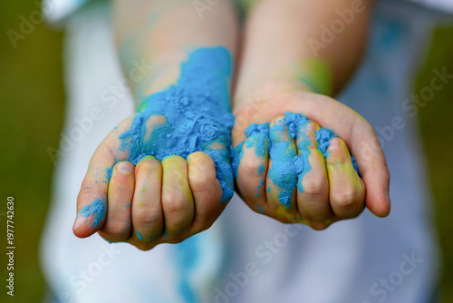 Hands in the dust of Holi