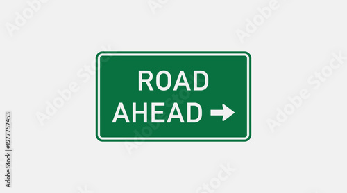 A vibrant green rectangular road sign clearly displays 'ROAD AHEAD' text with a directional arrow, providing essential guidance for drivers.