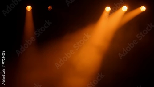 Wallpaper Mural Bright orange stage lights illuminating dark background with visible beams Torontodigital.ca