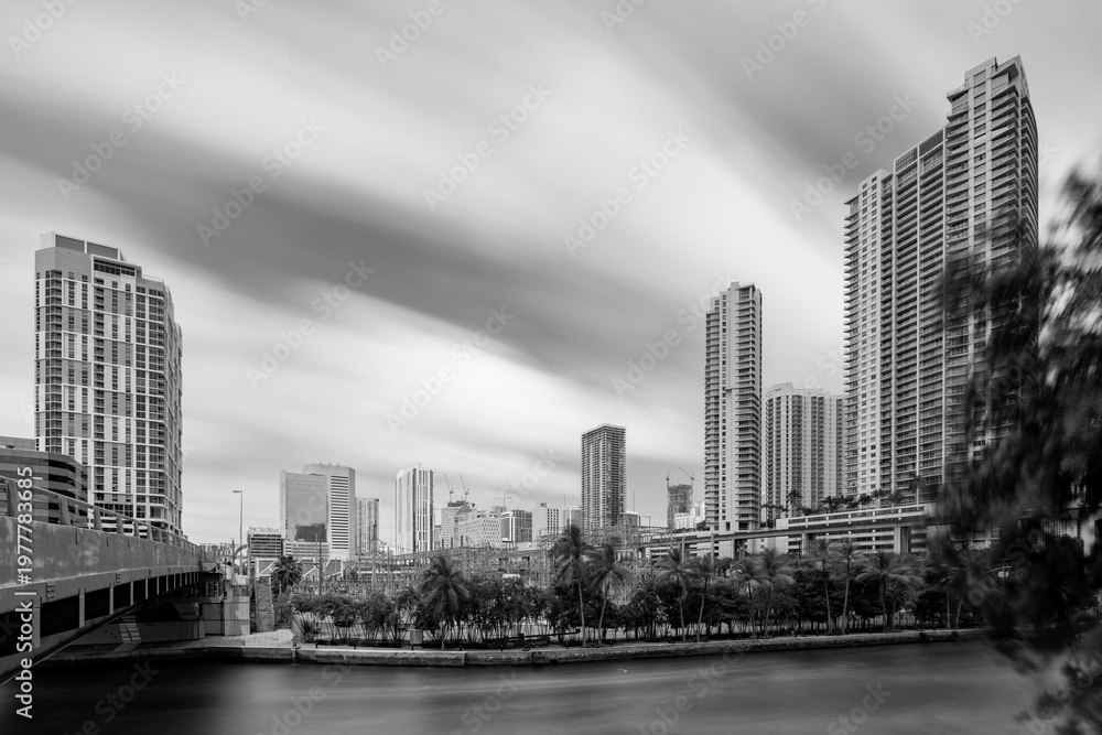 Fototapeta premium Long exposure photo Downtown Miami highrise towers with motion blur in clouds