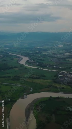 Wallpaper Mural Tropical mountain farmland with growing rice fields on riverside. Bukidnon, Philippines Vertical view. Torontodigital.ca