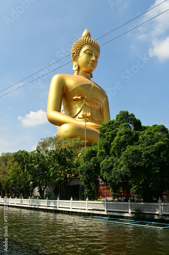 The Phra Phutthathamakaya Thepmongkol at Wat Pak Nam is a Buddha statue in the meditation posture and standing 69 meters tall. It is the tallest Buddha statue in Bangkok. Located in Thailand.