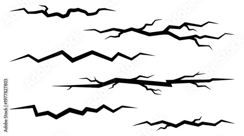Collection of stylized black vector crack illustrations depicting various forms of destruction, damage, and fractured surfaces for graphic design projects.