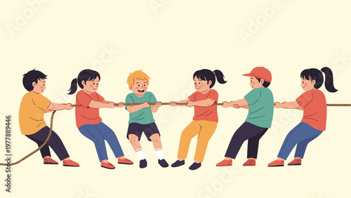 Group of happy children working together in teams while playing a fun and competitive game of tug of war outdoors.