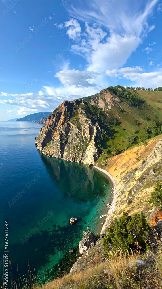 Fototapeta premium A serene coastal landscape with steep cliffs and clear blue water
