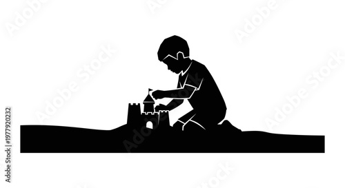 Boy Building Sand Castle.