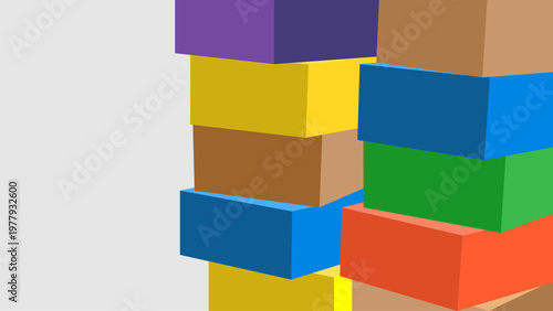 Stacked colorful box collection of various sizes arranged against a plain backdrop