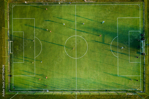 Foto Aerial drone top view photo of football pitch as seen in small mediterranean village