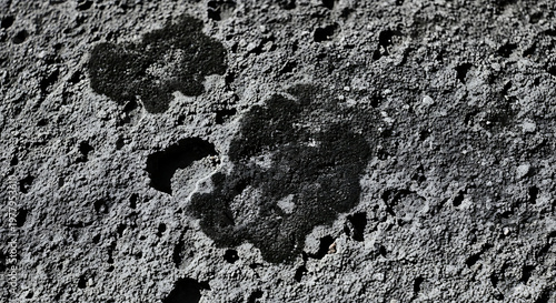 dark stains on granular concrete surface texture macro close-up for industrial material or abstract background design.