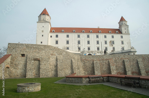 Bratislava Castle with medieval stone fortifications and garden benches, Slovakia