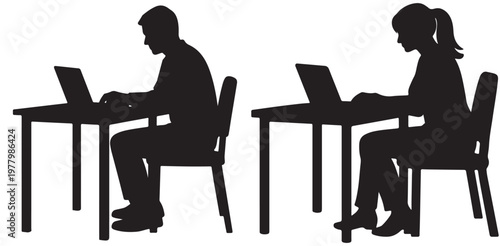 Two individuals working on laptops at separate desks in a focused environment