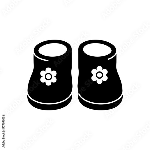 Black baby booties with flower decoration isolated on white