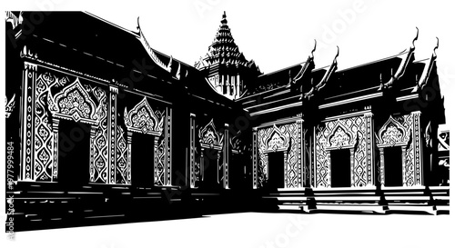 Intricate temple wall adorned with ornate patterns in black and white silhouette, showcasing detailed architectural design and cultural artistry