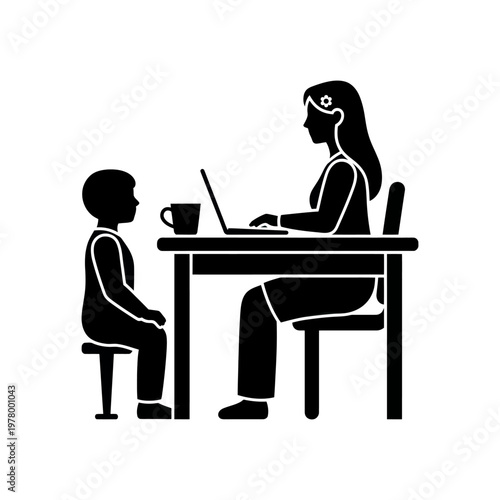 A woman working on a laptop with a child at the table