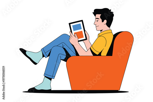 A man sitting comfortably in an orange chair while using a tablet device.