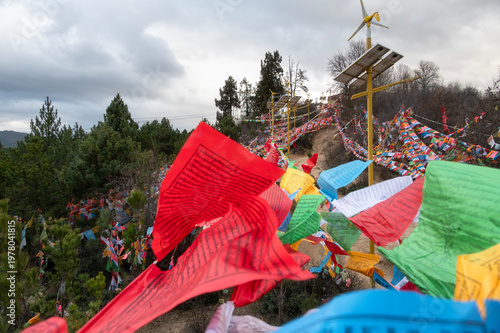Large volume of Prayer Flags and Prayer Wheels at hilltop of Baiji Temple, Baijisi, Shangri-la, Yunnan, China