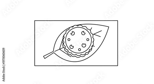 Simple line drawing of a tart on a leaf inside a rectangle