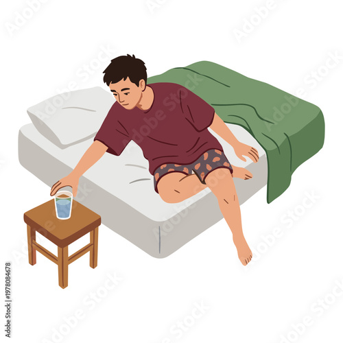 Man sitting on bed with green blanket reaching for glass on side table