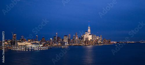 NYC night skyline with Manhattan. New York City aerial view of Manhattan. New York City, Manhattan skyline. New York panoramic cityscape. New York City Hudson skyline. NYC metropolis aerial view.