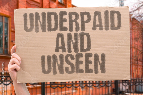 Fotografie "Underpaid And Unseen" Many essential service workers perform the most physically demanding labor while earning the least financial reward