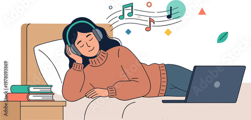 A woman lies on a bed listening to music with a laptop and books nearby.