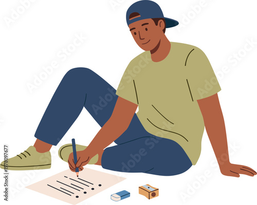 A man sits on the floor writing on a piece of paper with a pencil and eraser nearby