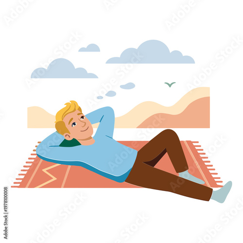 Man lying on rug in desert landscape thinking peacefully