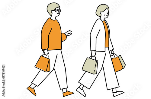 紙袋を手に楽しげに歩く義母と嫁