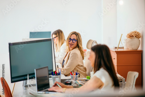 Professional women collaborating in a modern office working environment